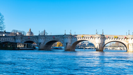 Fototapeta premium Paris, the Pont-Neuf on the Seine, typical panorama, with the dome of the Institut de France in background 