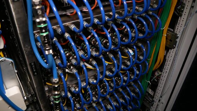 Supercomputer with many wires.
Specialized computer. Modern supercomputer with a large number of high-performance server computers connected to each other by local high-speed bus.