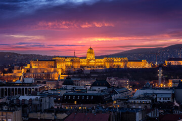 Elevated view of the illuminated Castle of Budapest, Hungary, dunring dusk with a colorful sky