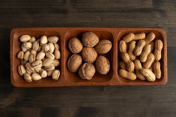 Variety of nuts on a wooden board