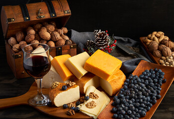 Variety of cheese on a wooden board