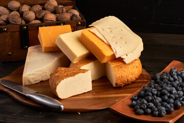 Variety of cheese on a wooden board
