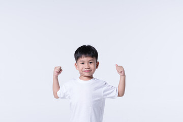 Healthy Asian boy with strong gesture