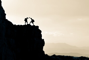 high mountain range and rocky mountain climbers