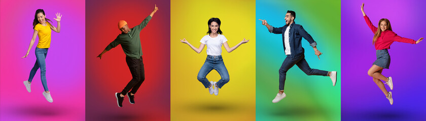 Interracial young people in casual clothes jumping and having fun on neon color studio backgrounds, panorama