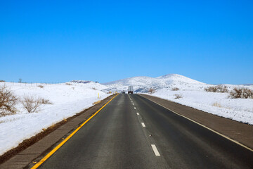 The scenery of a valley after a snowstorm, trees forest snowy road of Interstate 17 in Arizona