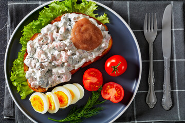 danish smorrebrod with shrimps, mayo, roe, and egg