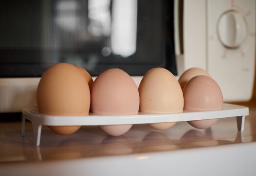 Organic Eggs In A Plastic Egg Tray Near Microwavable Oven