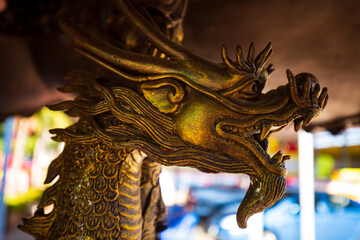 Fototapeta premium The forged figure of a winged dragon sculpture At worship of temple thailand.