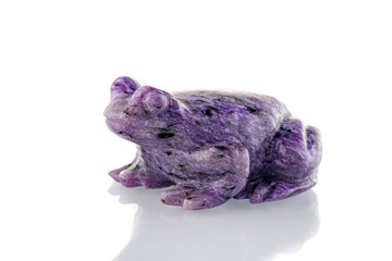 beautiful figurine of a toad from Charoite on a white background