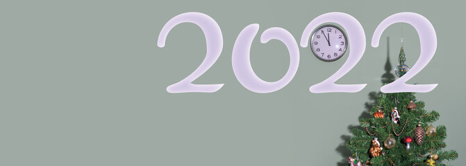 New year 2022 banner. Clock and Christmas tree on a green background