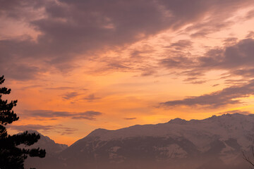 Obraz premium Vaduz, Liechtenstein, December 14, 2021 Colorful sky over the alps in the evening