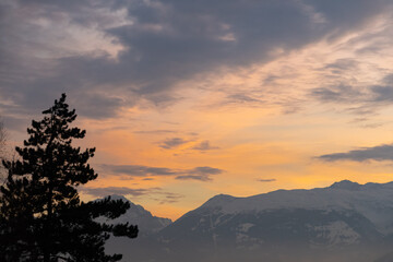 Vaduz, Liechtenstein, December 14, 2021 Colorful sky over the alps in the evening
