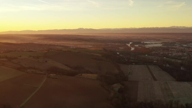 Panorama on the chain of the Pyrenees at sunrise, from Clermont le Fort, in Haute Garonne, Occitanie, France
