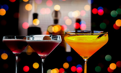 a glass of whiskey and wine on wood bar, romantic dinner setting.	