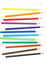 macro multicolored pencils on a white background