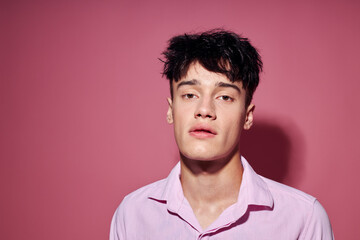 Photo of romantic young boyfriend in a pink shirt gesturing with his hands Lifestyle unaltered