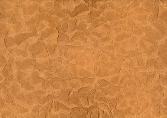 Old crumpled brown paper. Kraft paper with waves and wrinkles