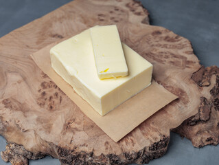 a rectangular piece of butter lies on the table - 478158314
