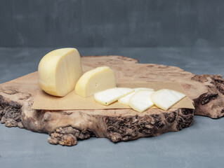 farm cheese on wooden stand on gray background - 478158375