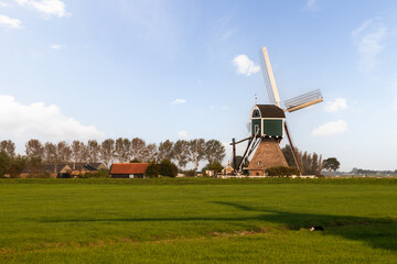 Seesaw mill in the Dutch landscape.