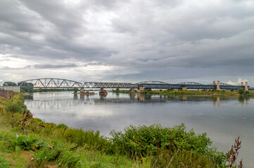Old bridges over Vistula river at cloudy day in Tczew, Poland.