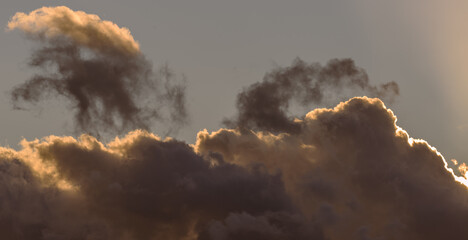Fototapeta na wymiar Orange contrasting cloudy sky at sunset. Banner.