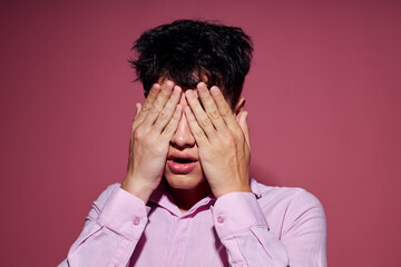 portrait of a young man posing fashion pink shirt modern style pink background unaltered