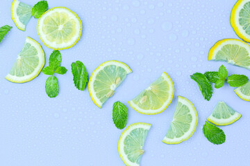Fresh cut lemon and mint leaves on white background. Top view
