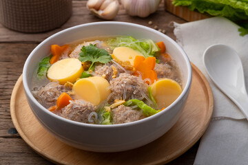 Close up Clear glass noodle soup with Minced Pork,Vegetables and egg tofu (Gaeng Jued Woon Sen)