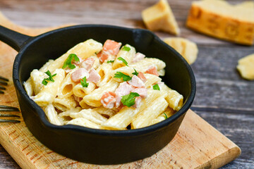  Fresh home made italian  penne  pasta   alla carbonara with  cream sauce  ,  bacon,egg, parmesan cheese ,olive oil and black pepper) 