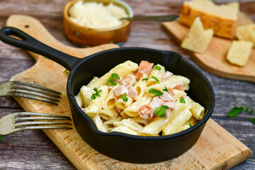  Fresh home made italian  penne  pasta   alla carbonara with  cream sauce  ,  bacon,egg, parmesan cheese ,olive oil and black pepper) 