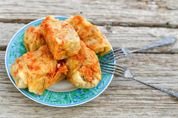 Cabbage rolls with meat, rice and vegetables. Stuffed cabbage leaves with  ground beef. Known as sarma, golubtsy, dolma.