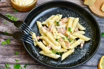  Fresh home made italian  penne  pasta   alla carbonara with  cream sauce  ,  bacon,egg, parmesan cheese ,olive oil and black pepper) 