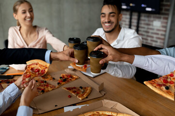 Lunch Break. Colleagues Clinking Takeaway Coffee Cups And Eating Pizza In Office