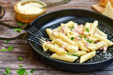  Fresh home made italian  penne  pasta   alla carbonara with  cream sauce  ,  bacon,egg, parmesan cheese ,olive oil and black pepper) 