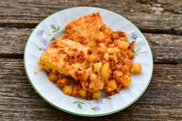  Potato and minced meat  Casserole  with   parmesan cheese and garlic on wooden rustic bakcground.  Bulgarian moussaka