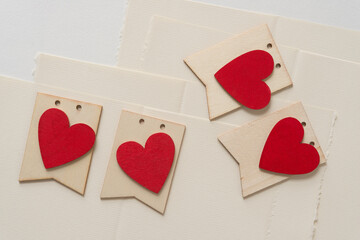 grungy wooden hearts on tags and paper