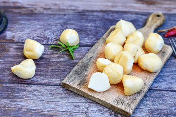  Smoked mini  traditional italian provola  cheese  on wooden background