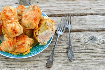 Cabbage rolls with meat, rice and vegetables. Stuffed cabbage leaves with  ground beef. Known as sarma, golubtsy, dolma.