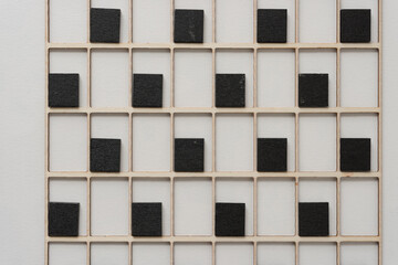 black tiles and wooden grid