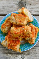 Cabbage rolls with meat, rice and vegetables. Stuffed cabbage leaves with  ground beef. Known as sarma, golubtsy, dolma.