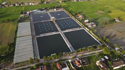 Aerial view wastewater treatment plant. Filtration of dirty water or waste water located in Bantul,...