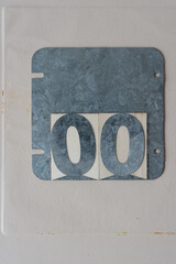 galvanized steel plate with two zeros on paper