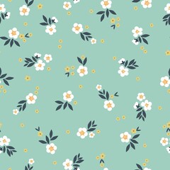 Beautiful vintage floral pattern. White and yellow flowers, dark blue leaves. Blue background. Floral seamless background. An elegant template for fashionable prints.