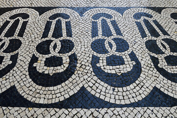 Traditional portuguese stone mosaic calcade in Lisbon
