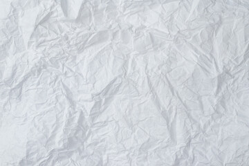 Crumpled white paper background.