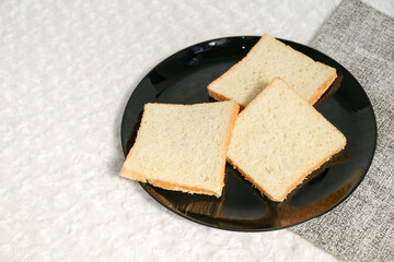 Plain toasted bread whole. White bread toast slice.	
