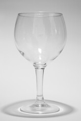 Glass cup on white background