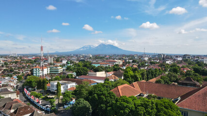 Fototapeta na wymiar Aerial view, the morning view of the city of Yogyakarta and the magnificent Mount Merapi.